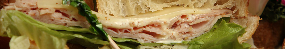 Eating Sandwich Cafe at Temptations Cafe restaurant in Brookline, MA.